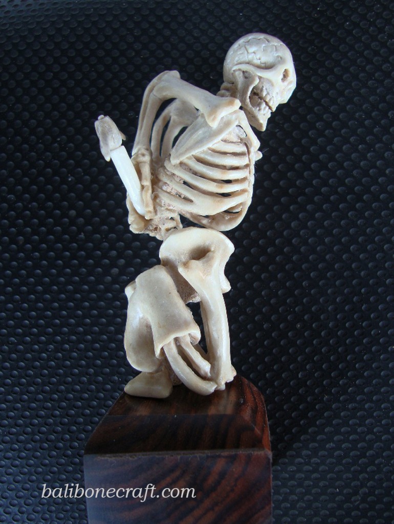 Skull with knife made from deer antelier produced by Bali bone craft the best Bali products made of bone 